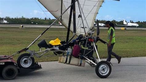 Cuban migrants fly into Key West airport on motorized hang glider
