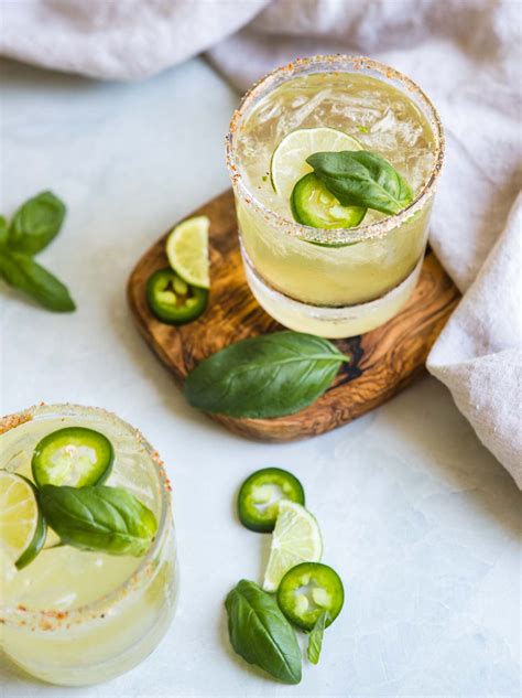 Cucumber jalapeno margarita. Pour mixture into a shaker. Add tequila, Cointreau and lime juice. Fill shaker with ice and shake heavily. Rub rim of 4 highball glasses with lime wedges and ... 