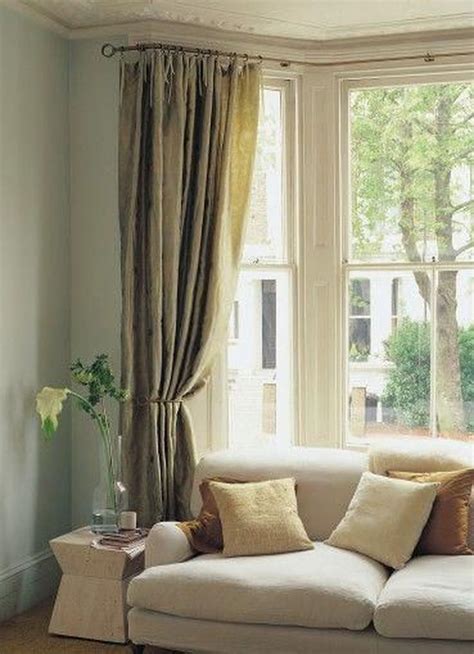 4. Design Bay Windows with Curtains and Shades. Bay windows can make the perfect backdrop for your favorite furniture and decor. Leave the window panes bare for tons of natural light and a great view. You can also use curtains, shades, or blinds to add a dose of color to your bay window design.. 