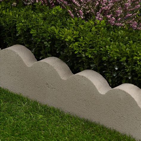 Garden edgers are easy to install and made from durable concrete. The scalloped design, red color and natural texture enhances any landscape. 24" Red Concrete Edging: Scalloped design, red color, 24" x 2" x 6", quick and easy installation, ideal for patios, walkways and flowerbeds. Durable, nearly maintenance-free.. 