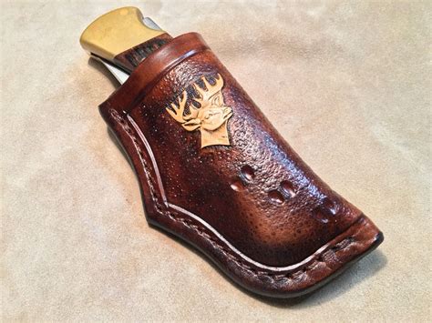 Custom leather knife Sheath with flap JS110-122. (113) $35.00. FREE shipping. Custom Leather Crossdraw Knife Sheath Made To fit a BUCK 110/112. Sheath ONLY Quality Leather. Made in USA Tight fit. (483) $28.99..