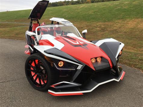 Slingshot R. Starting at $33,999 US MSRP. Plus commodity surcharge of $700 will apply. Plus destination charge and set-up. Trim & Color Options: Desert Sky (Manual) Top of the lineup thrills for those who never settle and love to stand out. Build Yours Learn More. . 