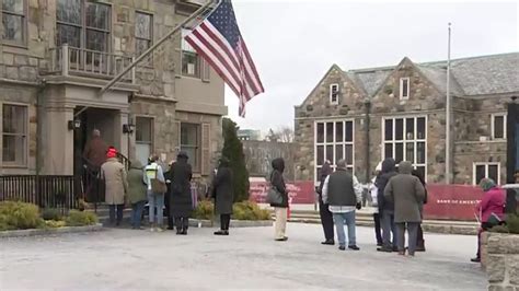 Customers line up at Silicon Valley Bank branch in Wellesley after fallout