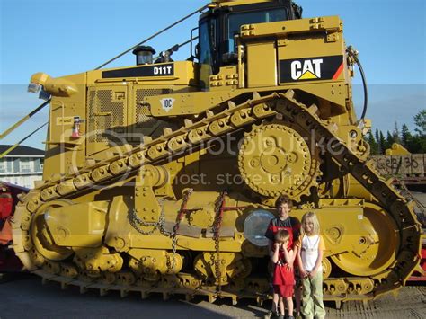 D11 dozer size comparison. Heavy bulldozer: Manufacturer: Caterpillar: Length: 35.8 feet (10.9 m) Width: 10.4 feet (3.2 m) (track); 22 feet (6.7 m) (blade) Height: 14.9 feet (4.5 m) (top of stack) Weight: 248,500 pounds (112,700 kg) (operating weight) Propulsion: Caterpillar tracks: Engine model: CAT C32 ACERT: Gross power: 936 horsepower (698 kilowatts) Flywheel power ... 