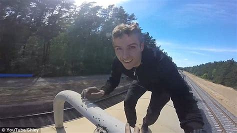 DAREDEVIL JUMPS CAR THROUGH SPEEDING FREIGHT TRAIN!