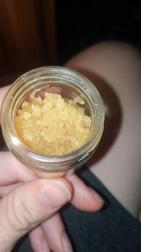 Sounds like poorly done CRC. The only time I've experienced that burnt popcorn/sulfur taste is from very shitty shit crc wax. Typically a sugary consistency, almost white/very light yellow, smells like vick's vapor rub.. 
