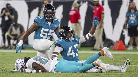 Daewood Davis of Dolphins carted off field after collision; preseason game vs. Jaguars halted