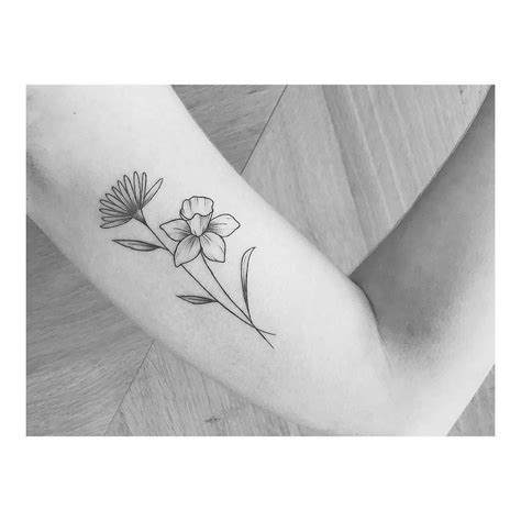 Daffodil and aster tattoo. Let’s start with these traditional aster flower tattoo designs are packed full of color and detailed designs. Big or small, each design is perfectly constructed to work beautifully on the skin. 1. Black Outlined Aster Tattoo. 2. Water Color September Birth Tattoo. 3. Bold September Aster Design. 4. 
