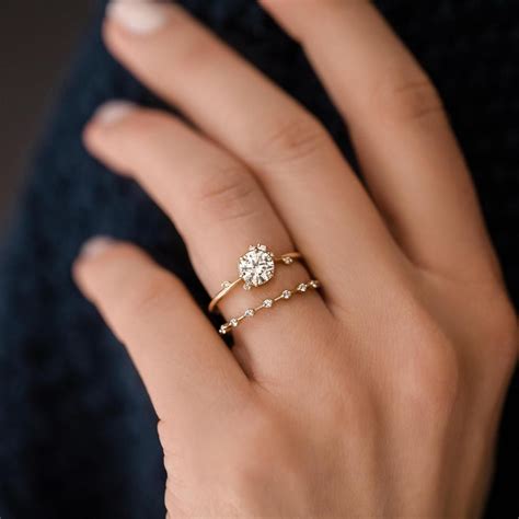Dainty wedding bands. Shop › Dainty Rings. Results per page. 40. In Stock Options 14k Gold Rounded Band Ring. $155 - $550. In Stock Options 14k Gold Thin Hammered Band Ring. $155. In Stock Options Set of 5 14k Hammered Gold & Diamond Rings. $625. 14k Tiny Spikes Eternity Ring. $550. 