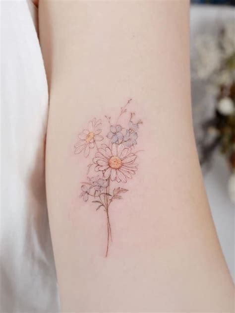 Daisy and larkspur tattoo. Whether you're a July child working the quirky larkspur, October's sunshine marigold, or an April baby daisy, birth flower tattoos are the latest Insta-worthy tattoo trend you'll love. Read on to ... 