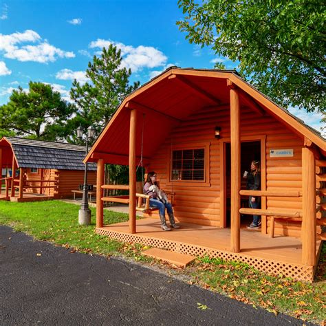About Dallas / Arlington KOA Holiday This beautiful, quiet KOA is located in the center of Arlington, between Dallas and Fort Worth. Stay in a Deluxe Cabin, furnished with linens and kitchen supplies, or in an air-conditioned Camping Cabin.. 