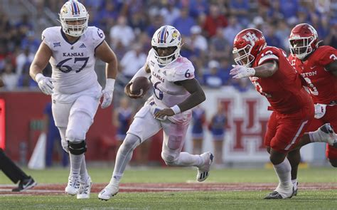 Kansas quarterback Jalon Daniels looks for a receiver against Kansas State on Nov. 26, 2022, in Manhattan. Daniels was named to the All-Big 12 second team on Wednesday. Colin E Braley AP. Lawrence .... 