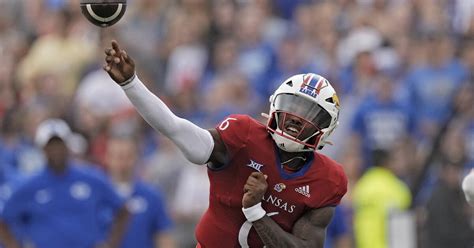 Daniels throws 3 TD passes, KU gets 2 defensive scores to beat BYU 38-27  in its Big 12 debut