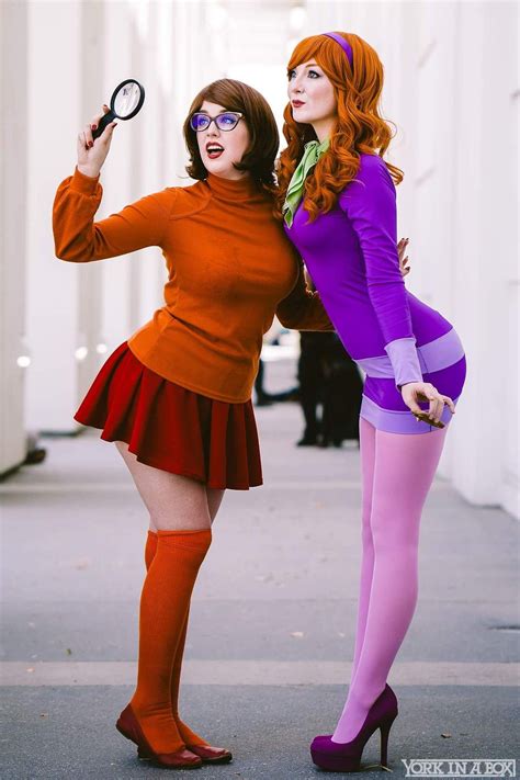 Daphne and velma costume. Product Description. Daphne is the orange haired girl from Scooby Doo. She's is a fashion guru and a journalist. This officially licensed Daphne costume features a purple dress, purple boot tops, a green scarf, and a big orange wig. Your girl will love solving mysteries in this great costume. 