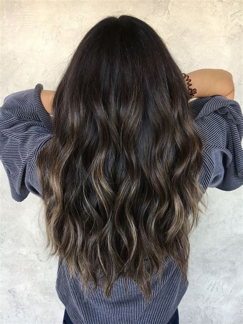 Dark brown hair with black lowlights. In terms of lowlights for darker shades, Cucinello loves to play with shades of black on dark brown hair. Dark mocha lowlights can also add a nice dimension to darker hair colors, too. 