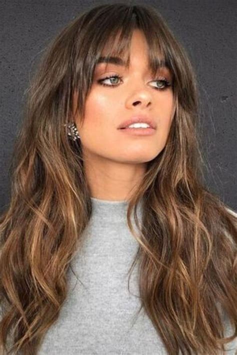 Dark hair with light bangs. Below are 51 beautiful wavy bangs hairstyles to try. 1. Cropped Bangs with Long Hair. Save. If you want to make your beautiful eyes the focus of your new hairstyle, go with very short wavy bangs. These ones are cut just an inch above the eyebrows and look gorgeous with long wavy hair. 2. 