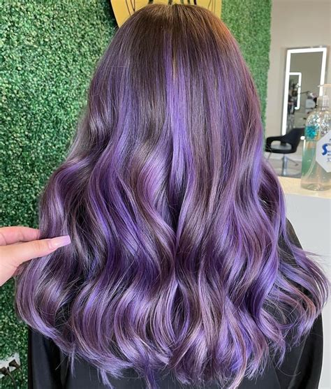 Dark purple highlights in brown hair. Pink and Purple. If you are still intimidated by purple, then combine it with … 