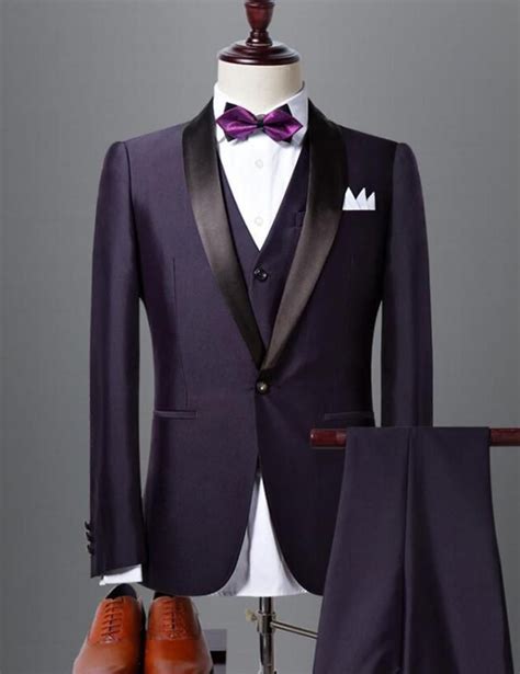 Dark purple suit. Many men's suit jackets have three buttons down the front. Leave them all unbuttoned and you look informal. Button them all and you look like a schoolboy in his first suit or a sch... 