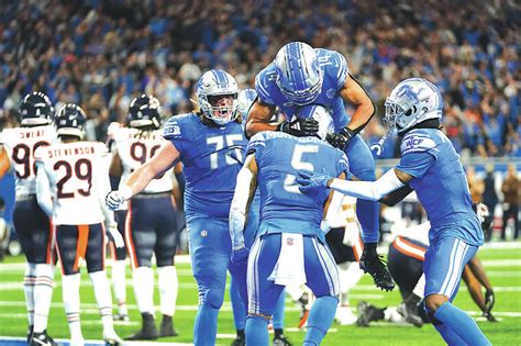 David Montgomery’s run caps Lions’ rally past Bears for 31-26 win and 8-2 record