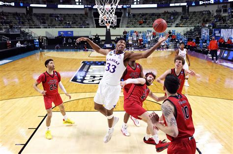 A spotlight focused on David McCormack as the 6-foot-10, 250-pound Kansas basketball newcomer positioned himself behind a set of drums in the southeast corner bleachers of Allen Fieldhouse.. 
