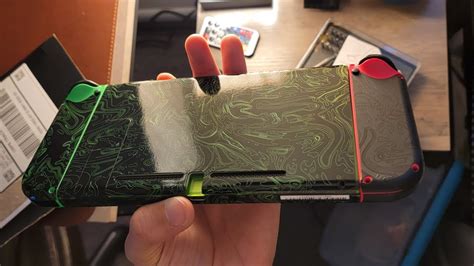 Dbrand acid. Damascus Acid skin is 🔥. Excited to receive mine if they ever decide to ship it. Looks great. It's still in review? Can't wait to get mine, looks awesome! A tip for dbrand: Please include a white logo for the cut out, to cover it, to not feel something that gap from the skin, like old good days. 