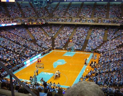 Dean smith center capacity. The Dean E. Smith Center, home of the North Carolina Tar Heels with a capacity of over 21,000. Walking into the Dean Smith Center, one of the first things that becomes apparent is the narrow concourse. With the 100 and 200 levels sharing the same concourse, walking around the stadium during big games can be difficult. 
