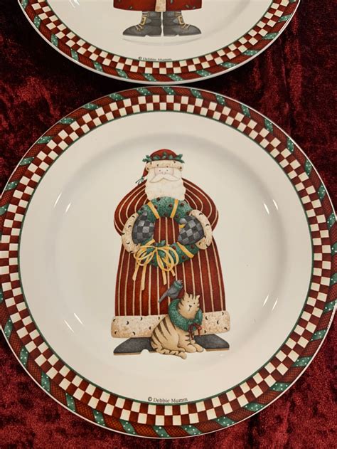 Debbie mumm christmas dishes. This auction is for a set of Christmas dishes designed by Debbie Mumm. The pattern is called Folk Art Santa. The set is in mint condition in the original box. It has only been out of the box for the p 