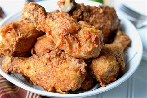 Deep fried chicken drumsticks. Bake in a 350 degree oven for 30 minutes. Remove from oven and baste. Place the chicken meat on a sheet pan. Bake on sheet pan to get the chicken skin crisp and the meat cooked through. Use a meat thermometer to be sure the meat is at least 165 degrees. Plate with the bottom of the drumstick down. Best eaten hot! 