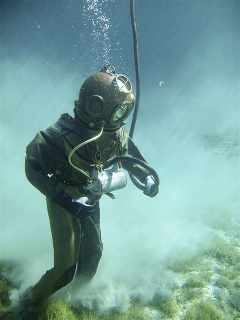 Deep sea diver. So how deep can we dive? In 1992 Comex, a French diving company, conducted a series of experimental dives to 2,133 feet (650 meters) of seawater in a hyperbaric research chamber in France. For two hours one diver went to 2,300 feet (701 meters), which is the deepest a human has gone under pressure (71.1 atmospheres) to date. 