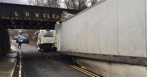 Delivery truck gets stuck under bridge in Billerica