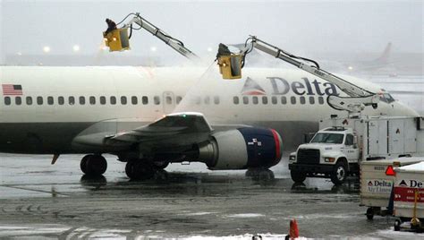 Delta Air Lines employees work up a sweat at boot camp, learning how to deice planes