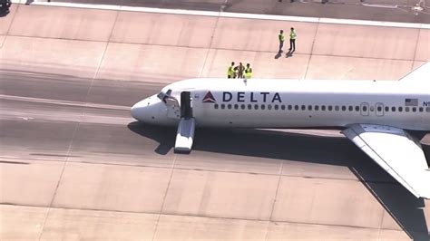 Delta plane lands with nose gear up at Charlotte airport