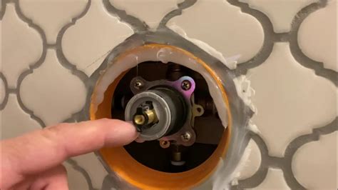 Hi, My tenant has complained that her shower goes from "freezing to scalding by just turning the knob a millimeter". We replaced the guts of the valve with a "tub and shower repair kit". I got an email now saying that it is worse than ever and the knob is too hard to turn and the water temperature is still not correcting properly.. 