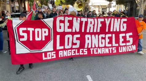 Demonstrators march to protest L.A. City Council's approval of rent hikes