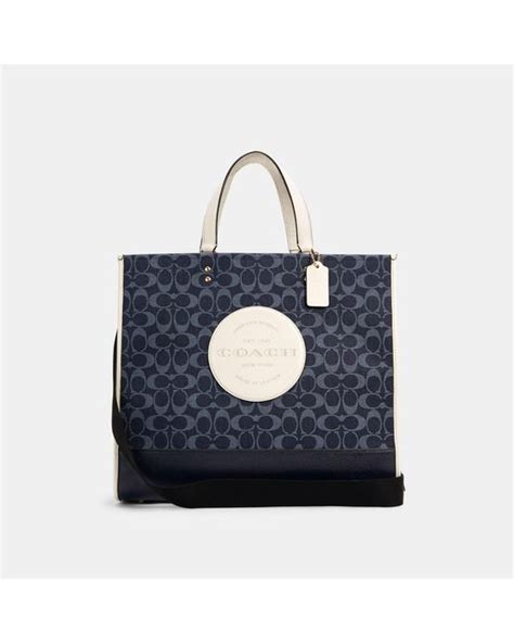 Buy COACH Dempsey Carryall In Signature Jacquard With Stripe Patch (SV/Denim/Midnight Navy Multi) and other Top-Handle Bags at Amazon.com. ... Coach Dempsey Tote 40 In Signature Jacquard With Stripe And Coach Patch. 4.3 out of …. 