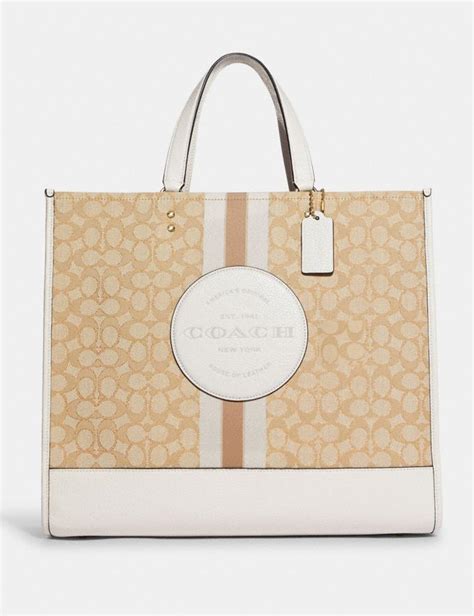AUTHENTIC COACH Dempsey Tote 40 In Blocked Signature Canvas. $300.00. + $25.05 shipping. NWT COACH LARGE DEMPSEY TOTE 40 IN SIGNATURE JACQUARD WITH STRIPE AND PATCH BAG! $149.99. Free shipping.. 