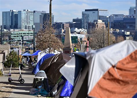 Denver’s mayor slams Texas governor over migrant buses after city sees new peak in shelters