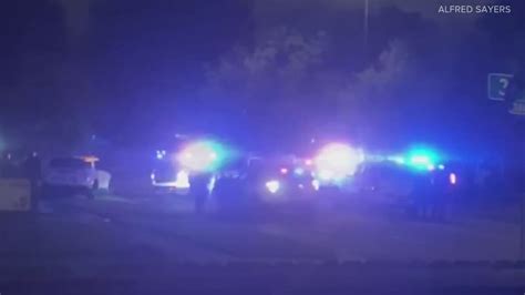Denver officer shoots armed suspect who held woman hostage after crash