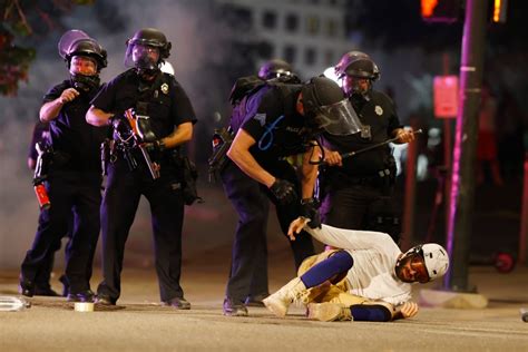 Denver to pay $550,000 to protester who lost eye after police shot him with projectile