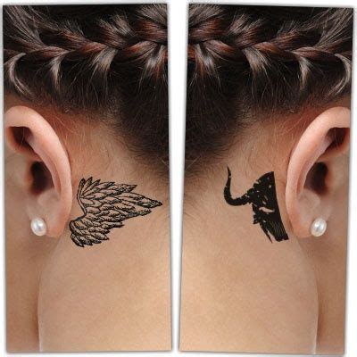Devil and angel tattoo behind ear. Try a Temporary Tattoo. This dual-design tattoo symbolizes the eternal battle between light and darkness. The left side showcases an angel wing, replete with intricate feather detailing and a crescent halo. In contrast, the right features a bat-like devil’s wing, capped off with a fiery red horn. 