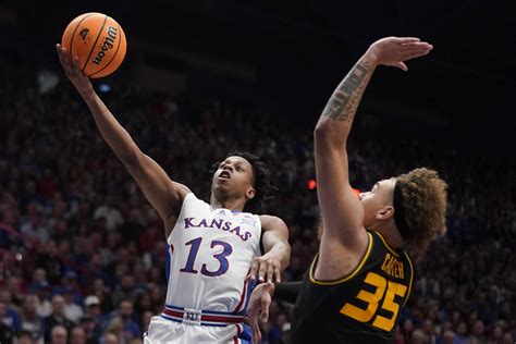 Dickinson scores 13 points, has 16 rebounds, helps lead No. 2 Kansas over rival Missouri 73-64
