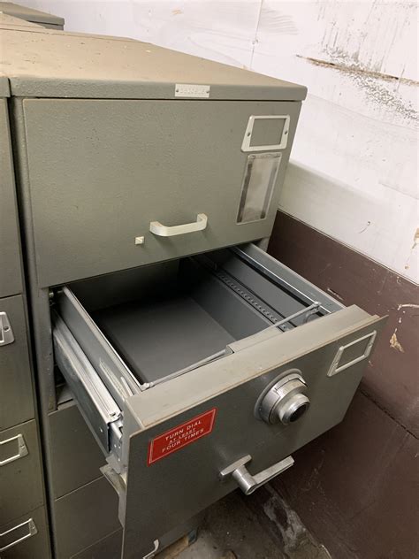 This safe may be used as a roll-about with the included casters, or may be bolted to the wall for more permanent installation. Wheel Assembly: 1. Place the Safe on its side for easy access to the bottom of the Safe. 2. Assemble each wheel using the included wheel axles. 3. Secure each wheel in place using Cotter Pin. Wheel Cotter Pin Wheel Axle 4.. 
