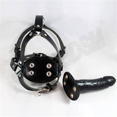 Dildogag. Dildo Gag Length. $64.00. A 3-in-1 fetish hood, mask, and mouth gag. Hood features Fixed circular eye and mouth openings Cord tightening tie down the back of hte hood Adjustable and lockable buckle neck strap Padded blindfold Dildo mouth gag in small or large The neck strap has 3 x D-Rings for attaching Dildo Length Short 5 cm 1.96" Long 10 cm. 