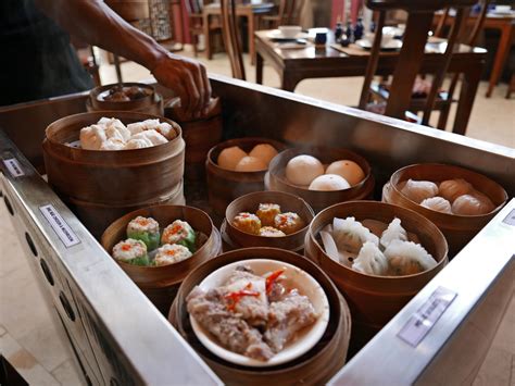 Dim sum cart. Dim sum is a feast of textures and flavors consumed to the cadences of Cantonese, clinking plates and squeaky wheels as servers push hand carts from table to … 