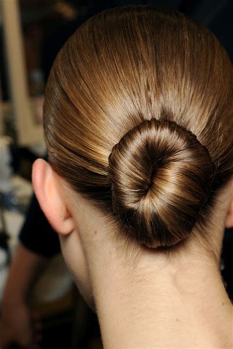 Discover the Allure of a Sculpted Bun: A Celestial Coiffure for Graceful Heads