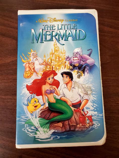Disney little mermaid original vhs cover. **RARE**,,Vintage The Little Mermaid VHS Movie. VHS Tape. Banned Cover Art ,View Pin: DS - Walt Disney Home Video VHS Case Mystery Pin ,The Little Mermaid VHS Original Censored Cover Vintage Disney Black Diamond Tape in Clamshel Initial First Cover Collectible Rare Banned Art,Was the original cover of The Little Mermaid VHS … 