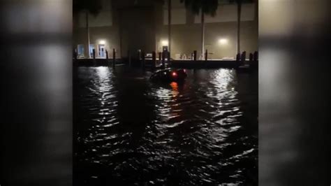 Divers search Fort Lauderdale canal after car found partially submerged