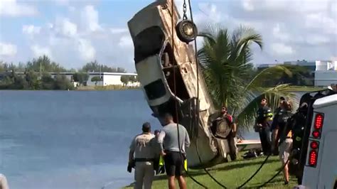 Divers working to retrieve almost 3 dozen submerged cars in Doral lake