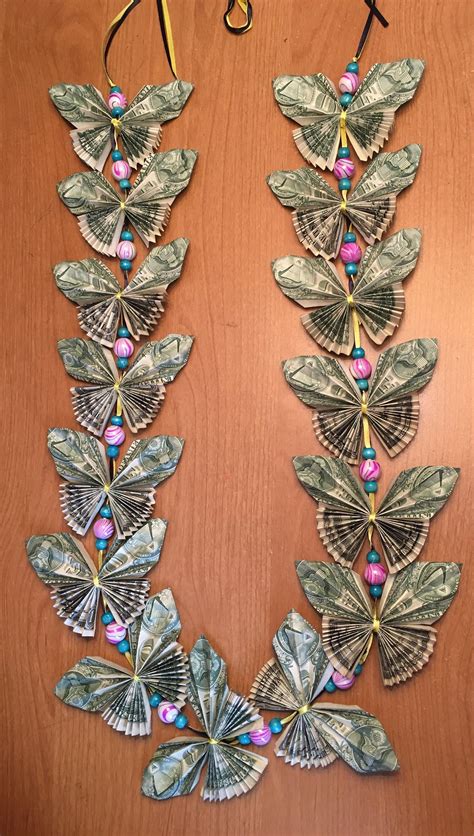 Diy butterfly money lei. Attach money flowers to a ribbon lei 😊One of the most common ways to use money flowers is to attach them to a ribbon lei. I'm going to show you a couple of ... 