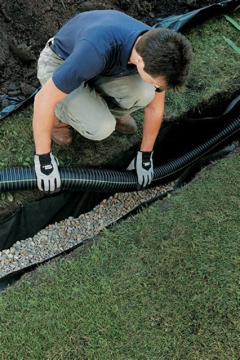Diy french drain. Fill the trench with wet concrete. Smooth the concrete with a pointed brick trowel. Press the channel drain down into the concrete, then check it with a level to ensure it’s sloping slightly toward the drainpipe. Tap down the drain with a rubber mallet. Use the trowel to spread an angled wedge of concrete against the back of the drain. 